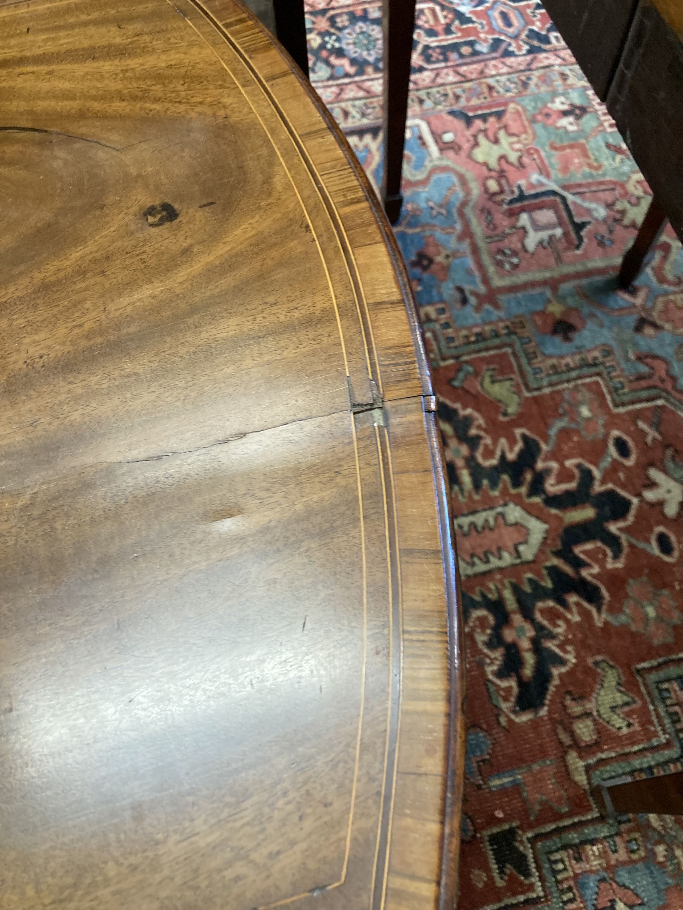 A George III rosewood banded and inlaid mahogany oval Pembroke table, width 79cm depth 49cm, height 68cm